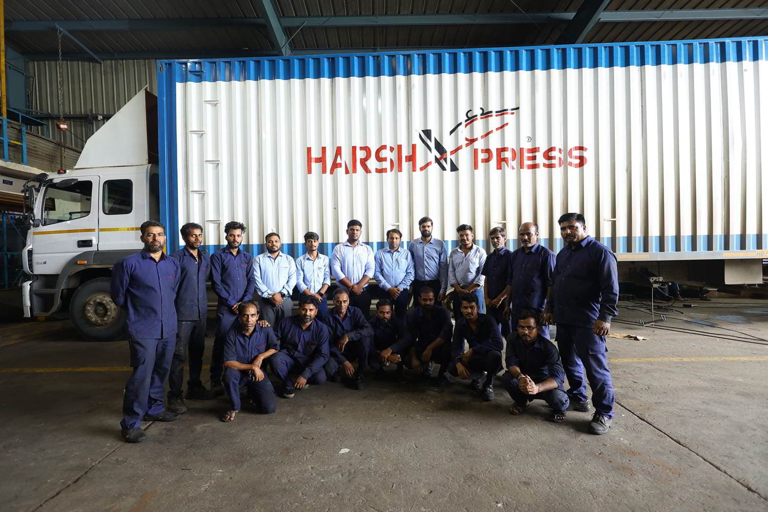 The Harsh Express team with their blue trucks